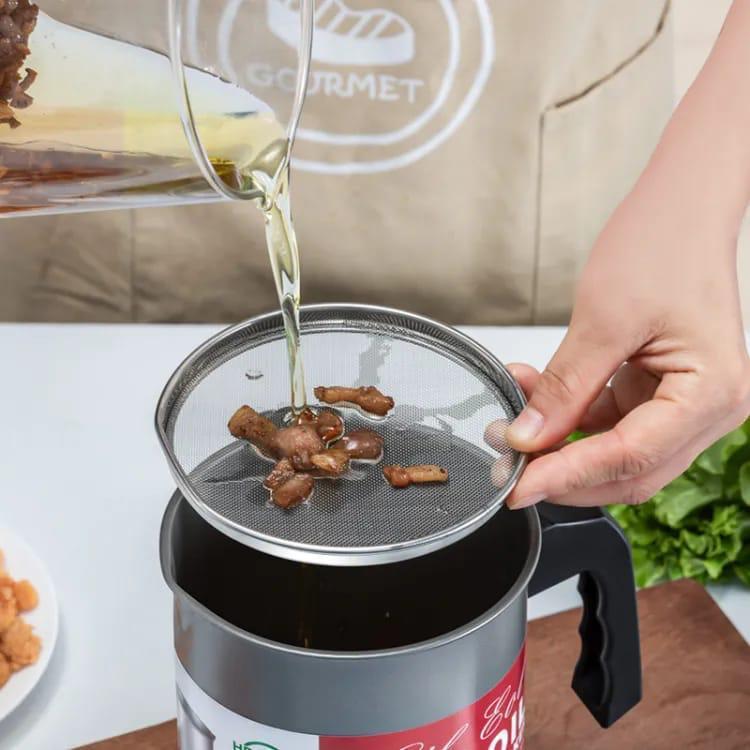 Stainless steel oil strainer pot with mesh filter and anti-drip spout for clean oil storage